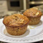 Close-up of moist gluten-free banana muffins with a golden-brown crust.