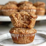 Close-up view of healthy breakfast muffins with blueberries and a golden-brown top.