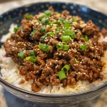Close-up side view of a Korean Beef Bowl featuring ground beef, rice, and vegetables.