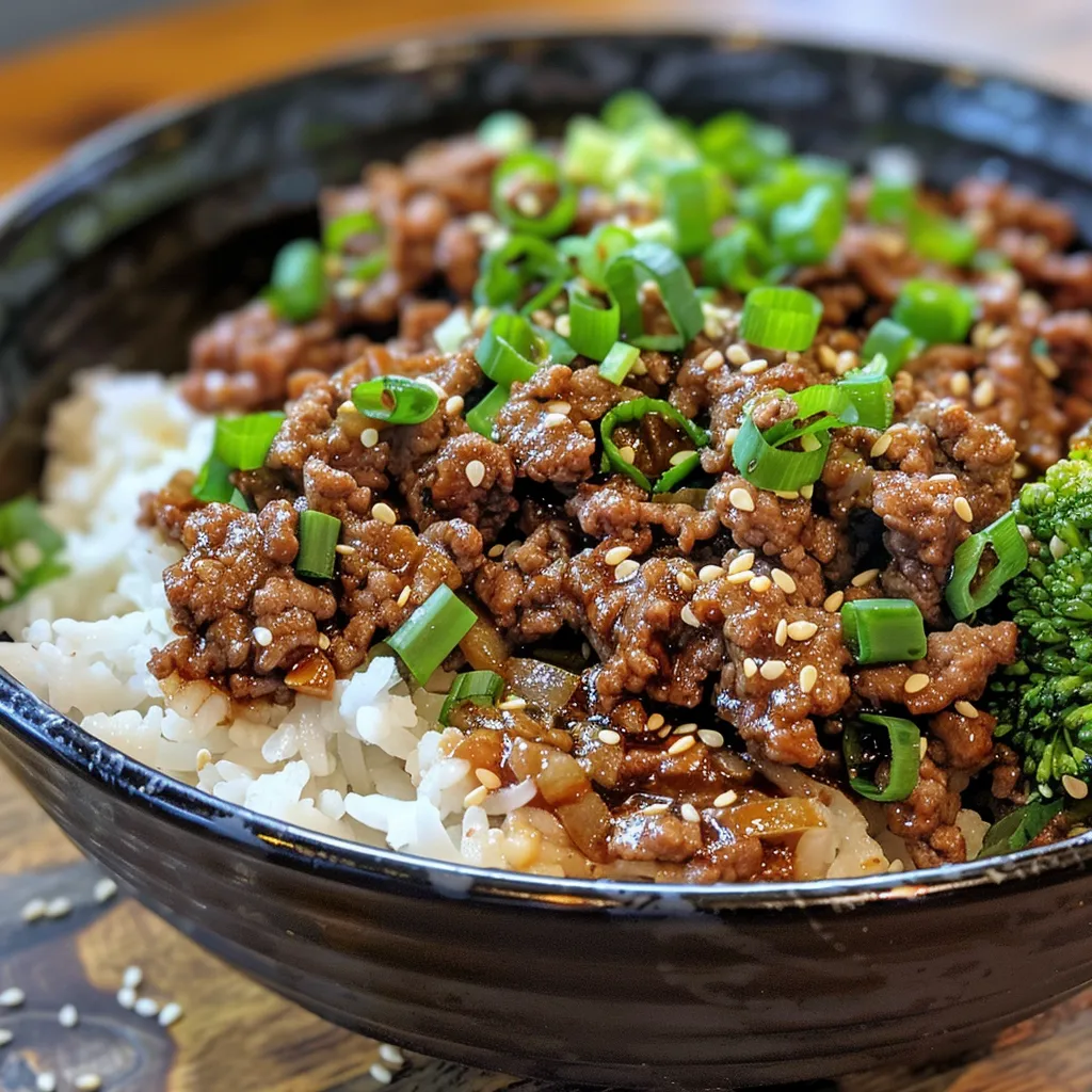 Juicy Korean Beef Bowl with garnished green onions and sesame seeds, showcasing colorful ingredients.