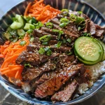 A close-up side view of a Korean Beef Power Bowl with vibrant vegetables and rice.