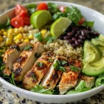 Close-up of a Flavor-Packed Chicken and Quinoa Dinner Bowl with vibrant ingredients.