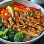 A colorful Balanced Chicken & Veggie Power Bowl featuring chicken strips and a variety of fresh vegetables.