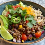 Close-up view of a delicious ground beef burrito bowl with fresh ingredients.
