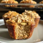 Close-up view of healthy banana oatmeal muffins with a golden-brown crust.