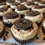 Close-up of Oreo Cheesecake Bites with a creamy texture and crushed Oreos on top.
