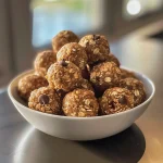 Close-up view of juicy Peanut Butter Energy Balls with chocolate chips.