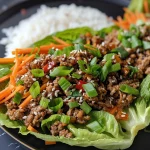 Close-up view of Asian-style ground beef lettuce wraps filled with ground beef and vegetables.