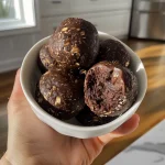 Close-up view of delicious Brownie Protein Bites, showcasing texture and chocolate chips.
