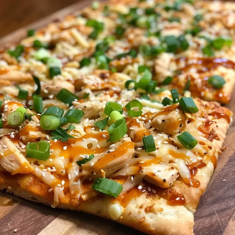 ['Close-up view of a flatbread topped with teriyaki chicken and melted cheese.', 'Side angle of a delicious flatbread dinner with colorful toppings and drizzled sauce.', 'Juicy flatbread loaded with diced chicken, cheese, and green onions on a plate.', 'Appetizing flatbread featuring teriyaki chicken, cheese, and garnishes for added flavor.']