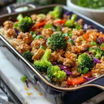 ['Side view of a juicy Teriyaki Turkey Casserole with colorful vegetables.', 'Close-up of a delicious turkey casserole featuring broccoli, bell pepper, and rice.', 'Savory slice of Teriyaki Turkey Casserole highlighting ground turkey and vibrant veggies.', 'Appetizing dish of Teriyaki Turkey Casserole, showcasing layers of turkey, rice, and vegetables.']