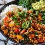 ['Close-up of a colorful Chipotle Ground Turkey Skillet Meal in a bowl.', 'Side view of a prepared Chipotle Ground Turkey Skillet with vibrant vegetables.', 'Juicy ground turkey skillet meal with rice and fresh toppings displayed in a bowl.', 'Delicious Chipotle turkey meal prep with peppers, onions, and garnishes.']