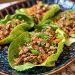 ['Close-up view of ground turkey served over garlic butter rice.', 'Juicy ground turkey in a savory garlic butter rice dish, side perspective.', 'A plate of ground turkey with garlic butter rice, highlighting textures and garnishes.', 'Side shot of a delicious meal featuring ground turkey and fluffy garlic butter rice.']