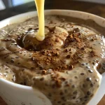 ['A close-up view of creamy Chai Latte Chia Pudding in a glass jar, topped with a sprinkle of cinnamon.', 'Side view of Chai Latte Chia Pudding with a rich, creamy texture and spices visible on top.', 'Delicious Chai Latte Chia Pudding in a jar, featuring a colorful layer of cinnamon and chia seeds.', 'A refreshing serving of Chai Latte Chia Pudding with a smooth surface and contrasting spices.']