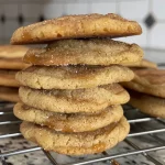 A close-up view of a golden Caramel Apple Snickerdoodle with a soft, chewy texture.