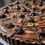 A side view close-up of a Halloween Chocolate Spiderweb Tart, showcasing its intricate chocolate web design.